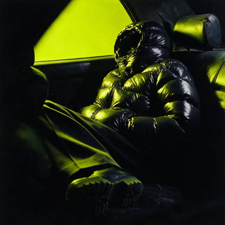 A quiet moment in a car, single light source