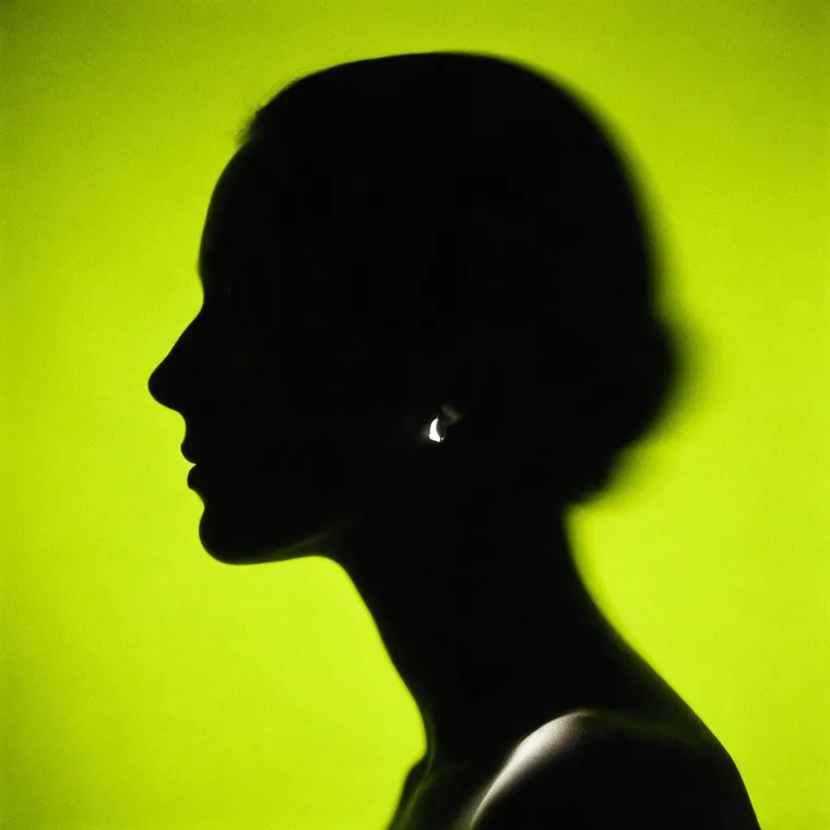 Silhouette against a single hard light