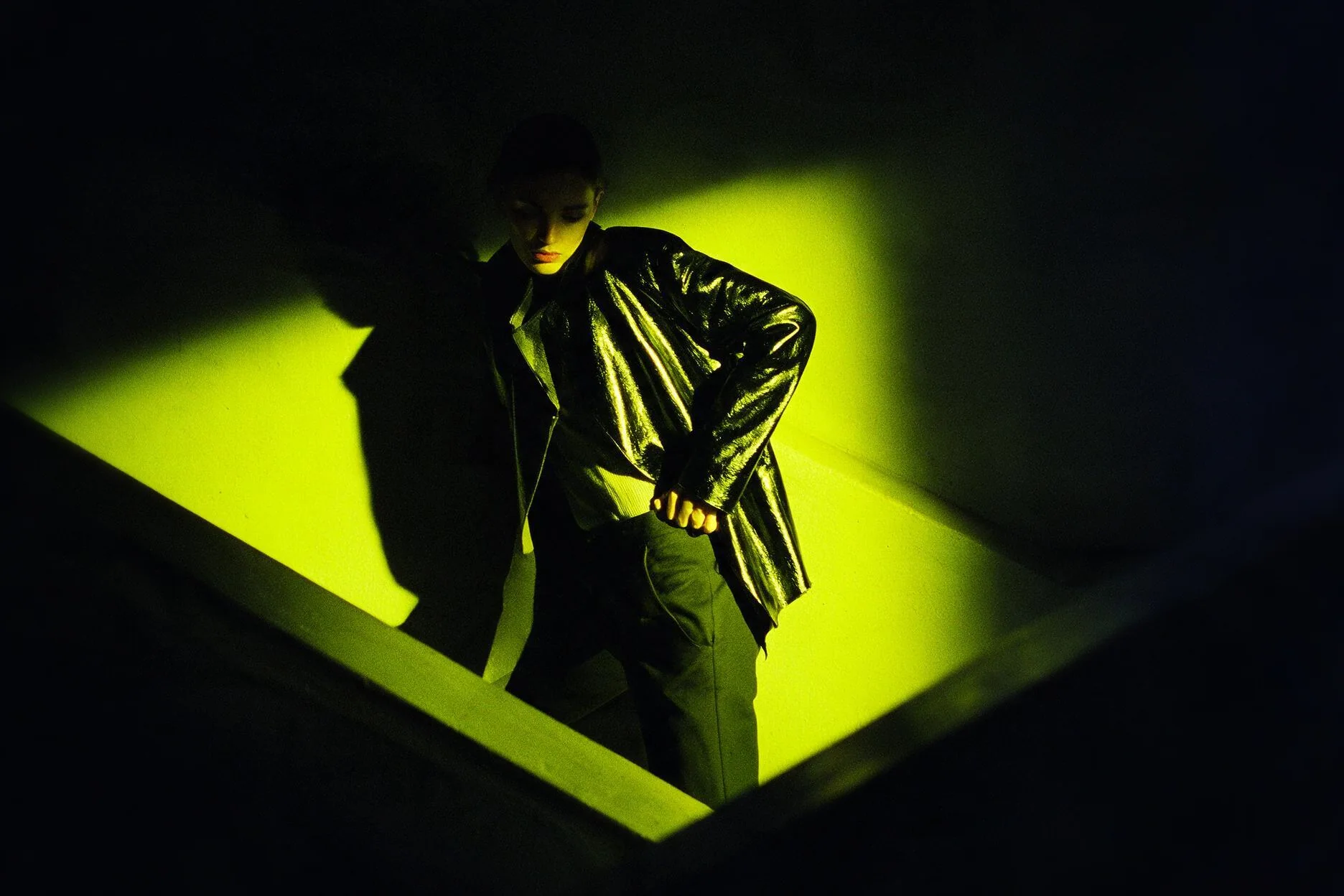 A figure on a stairwell, hard light and shadow